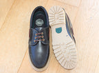 Chaussures bateau en cuir noir sur semelle épaisse