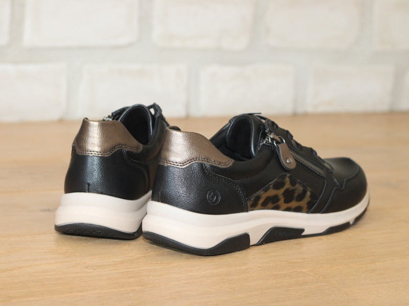 Baskets compensées Remonte en cuir noir et imprimé animal