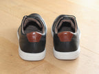 Baskets en cuir noir et semelle blanche