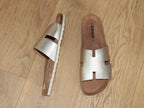 Mules plates en cuir doré Emma