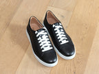 Baskets Cleve en cuir noir et semelle blanche